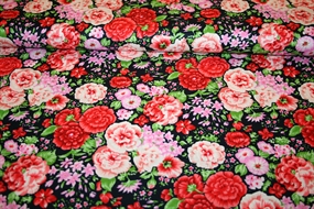 Bomuldsstof med farvestrålende blomsterprint