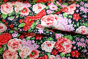 Bomuldsstof med farvestrålende blomsterprint