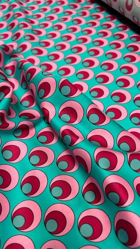 Bomuldsstof med retro-print i turkis og lyserød
