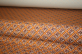 Blomstret orange silke -og uldblanding