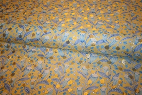 Silke chiffon med guldprikker og blå blomster på en gul bund